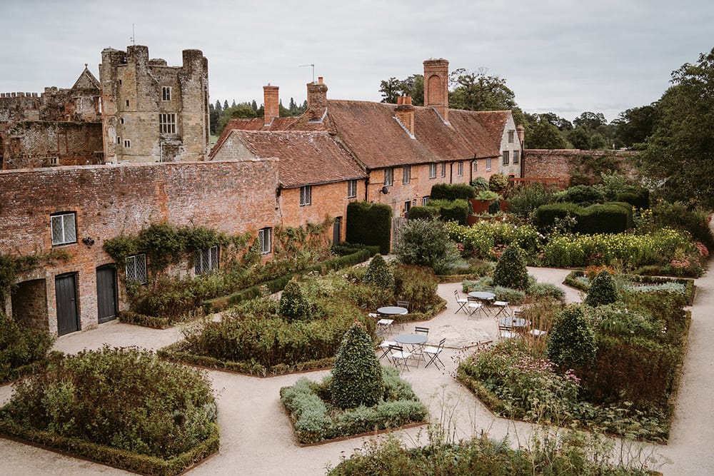 Image by <a class="text-p3" href="https://owenthomasweddings.com" target="_blank">Owen Thomas Photography</a> at Cowdray Walled Garden.