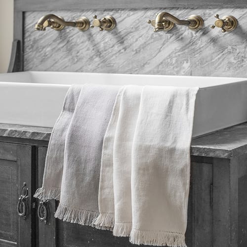 The Linen Works Motte Fringe Hand Towel, Chalk - £26.00.