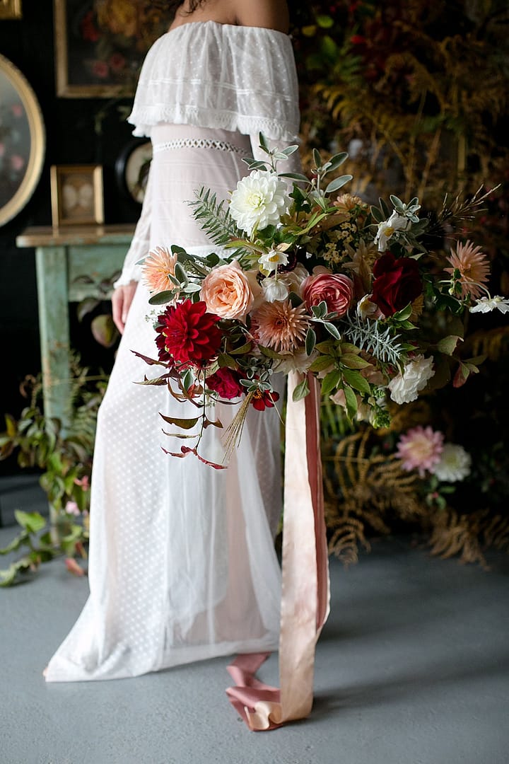 Image by <a class="text-p3" href="http://www.corettefauxphotography.co.uk" target="_blank">Corette Faux Photography</a> | Flowers by <a class="text-p3" href="https://jennibloom.com" target="_blank">Jenni Bloom Floral Design Studio</a>.