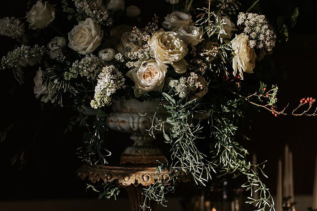 Image by <a class="text-taupe-100" href="https://www.damienmilan.com" target="_blank">Damien Milan Photography</a> | Flowers by <a class="text-taupe-100" href="https://www.mossandstone.co.uk" target="_blank">Moss & Stone Floral Design</a>.