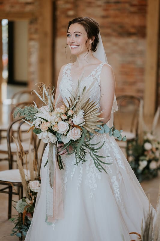 Images by <a class="text-taupe-100" href="https://www.laurashaw.co.uk" target="_blank">Laura Shaw Photography</a> and <a class="text-taupe-100" href="https://drewbucklerweddings.com/" target="_blank">Drew Buckler Weddings</a>.