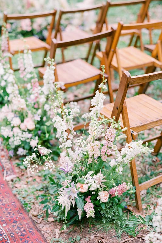 Image by <a class="text-taupe-100" href="http://www.hannahduffy.com" target="_blank">Hannah Duffy Photography</a> | Chairs by <a class="text-taupe-100" href="http://www.hire-love.com" target="_blank">Hire Love</a> | Flowers by <a class="text-taupe-100" href="https://www.verityandthyme.co.uk" target="_blank">Verity & Thyme</a>.